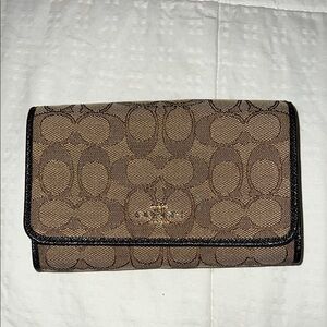 Coach Tan and Black Signature Clutch